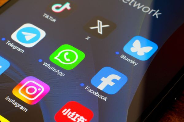 In this photo illustration, the social media apps TikTok, X