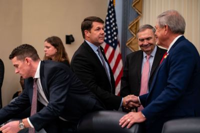 House Budget Committee Chairman Rep. Jodey Arrington, center, greets Freedom Caucus member Rep. Ralph Norman before the start of a Budget Committee meeting on February 13, 2025, in Washington, D.C. (Photo by Kent Nishimura/Getty Images)