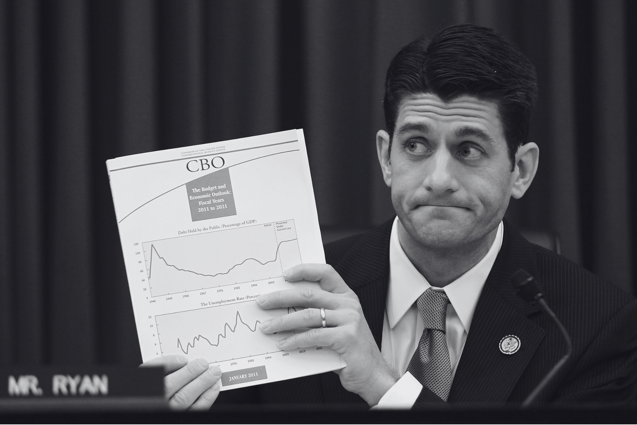 Then-Committee Chairman Rep. Paul Ryan holds up a copy of Congressional Budget Office's "The Budget and Economic Outlook: Fiscal Years 2011 to 2021" during a hearing before the House Budget Committee on February 10, 2011. (Photo by Alex Wong/Getty Images)