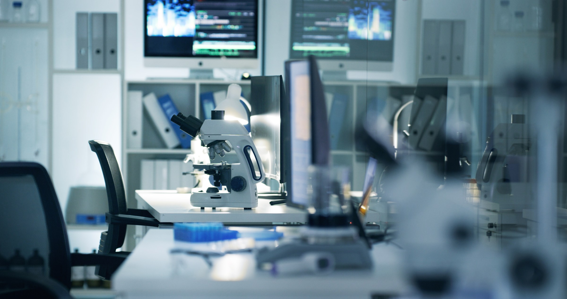 Scientific, research and medical labratory where scientists conduct futuristic science experiments. Empty lab with microscope, equipment and advanced technology for learning and testing biochemistry