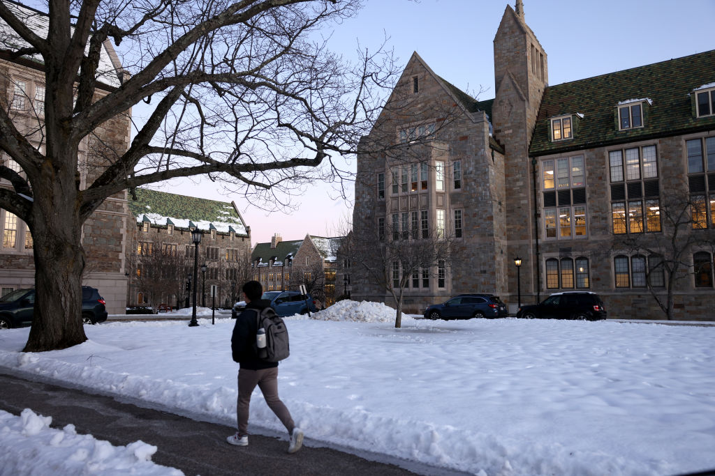 A student walked across the Boston College campus. (Photo by Jessica Rinaldi/The Boston Globe via Getty Images)