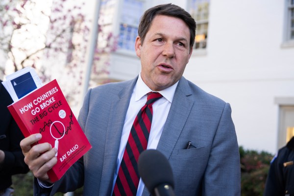 Rep. Jodey Arrington holds a copy of the Ray Dalio book How Countries Go Broke outside the Capitol Hill Club after a meeting of the House Republican Conference on Tuesday, March 25, 2025. (Tom Williams/CQ-Roll Call, Inc via Getty Images)