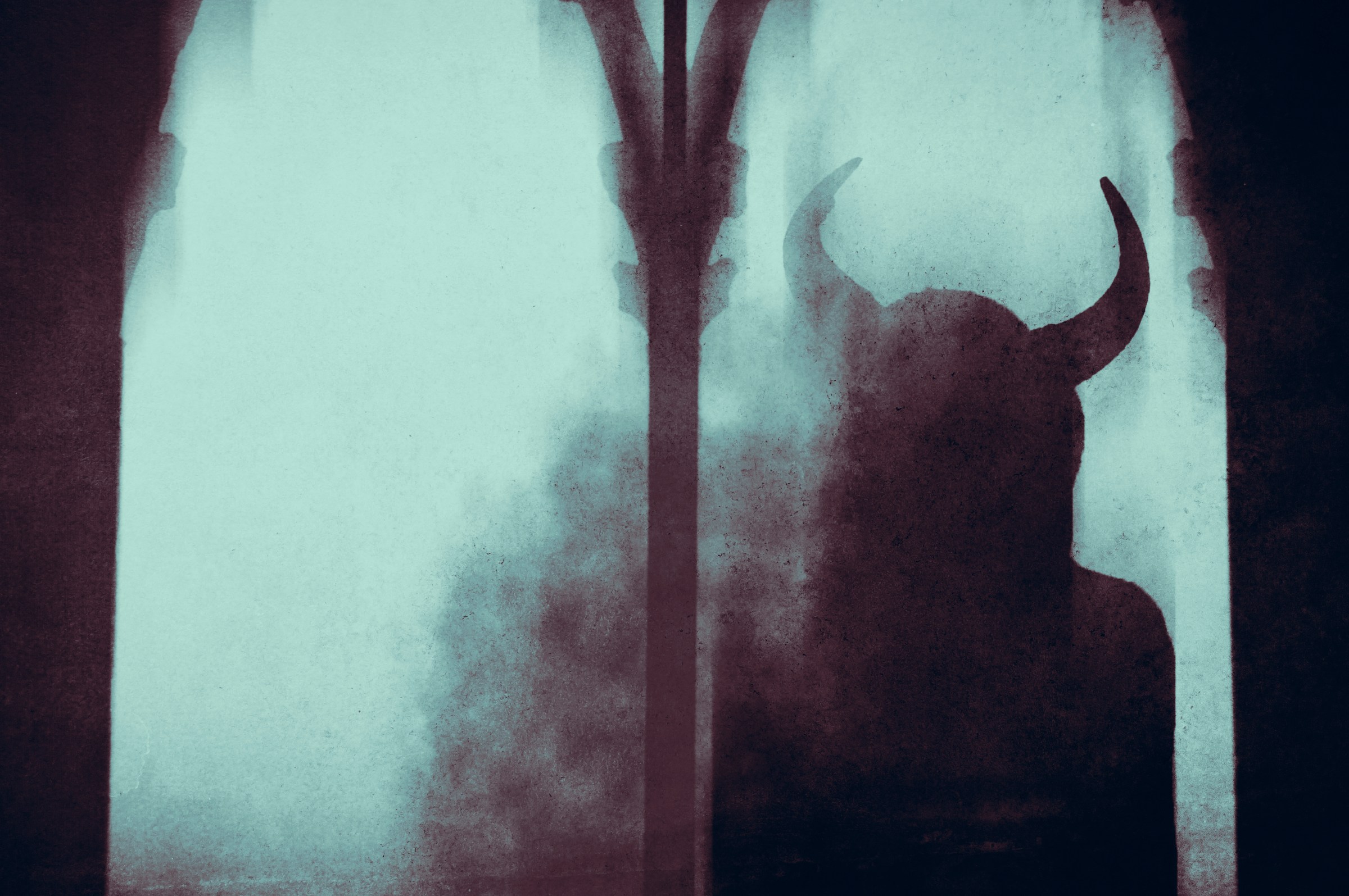 A dark fantasy concept . Of a mysterious devil woman with horns, looking out of a window in an old building, With a blurred, abstract edit.