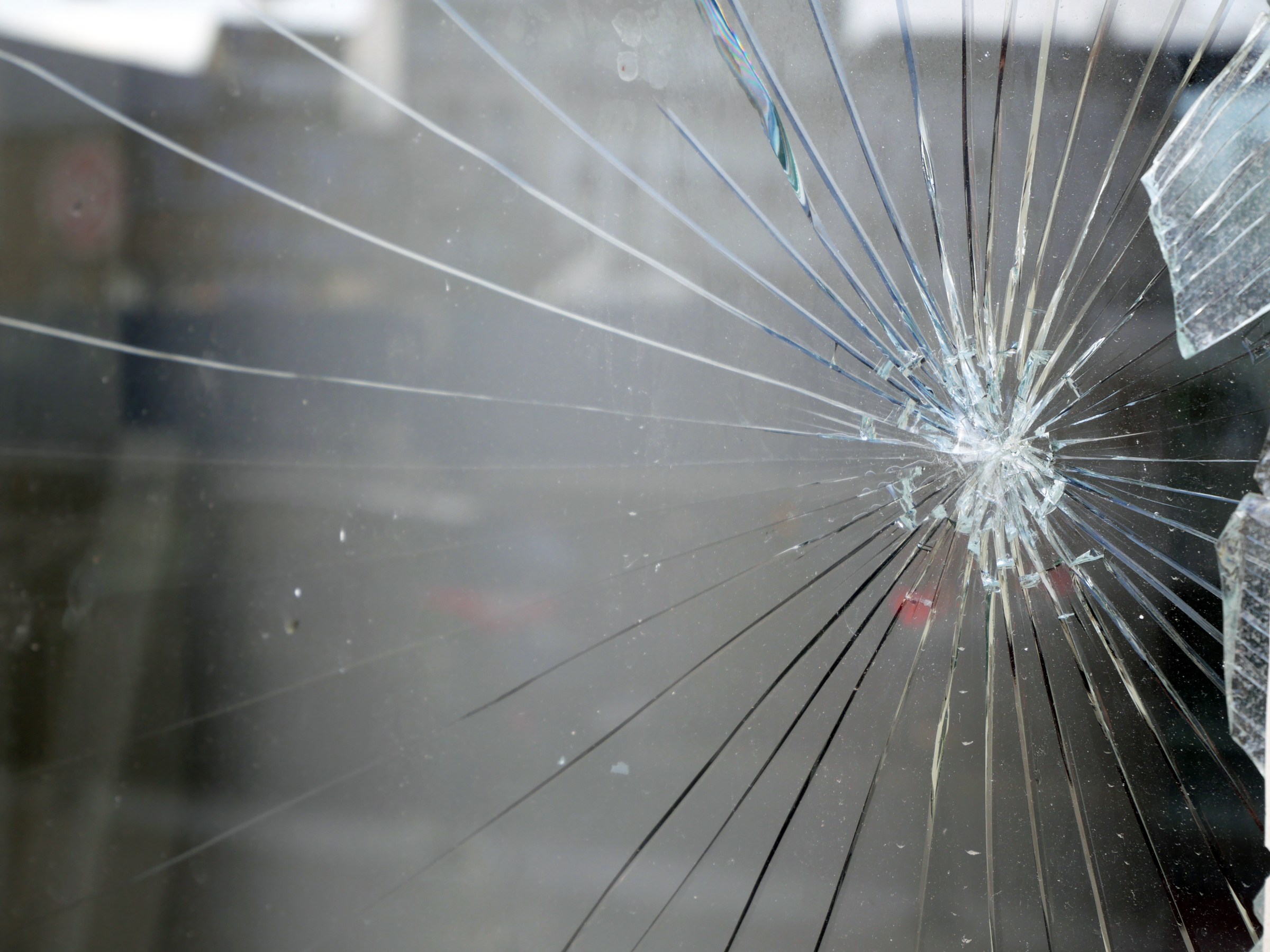 Close-up of a window shattered by an impact in Brussels, Belgium