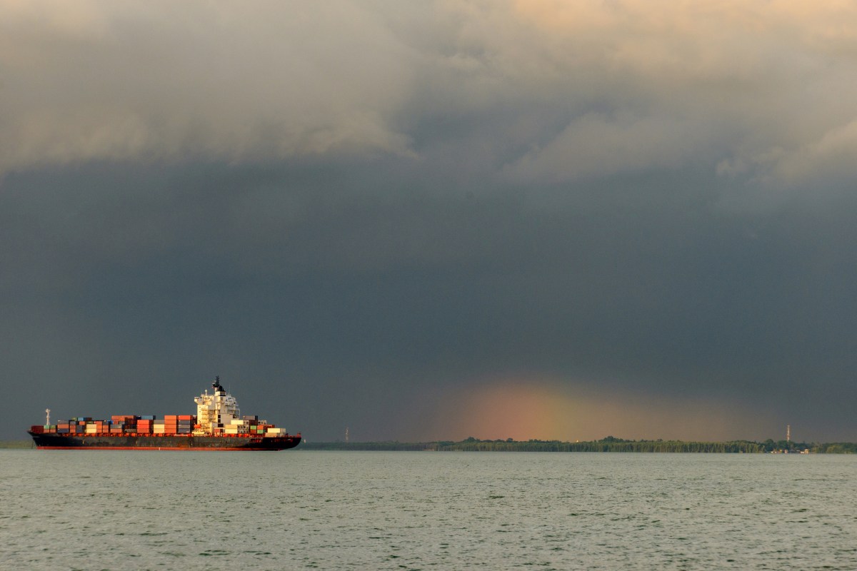 Container ship sailing through a storm
