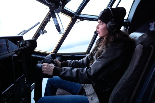 Homeland Security Secretary Kristi Noem helps fly an HC-130J during an aerial tour from Coast Guard Air Station Kodiak on March 17, 2025, in Kodiak Station, Alaska. (Photo by ALEX BRANDON/POOL/AFP via Getty Images)