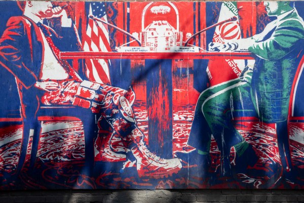  A mural depicting two officials sitting across a table is seen painted on the outer walls of the former U.S. embassy in Tehran on April 19, 2025 in Tehran, Iran. Talks between the United States and Iran over the fate of the Islamic Republic's uranium enrichment program continue at the Omani embassy in Rome. (Photo by Majid Saeedi/Getty Images)