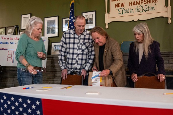 Poll workers prepare to open polling just before midnight on January 22, 2024, in Dixville Notch, New Hampshire. (Photo by Scott Eisen/Getty Images)