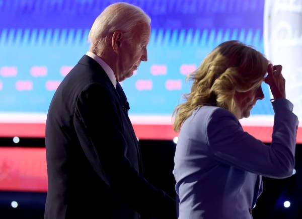 President Joe Biden walks off with first lady Jill Biden following the CNN Presidential Debate at the CNN Studios on June 27, 2024 in Atlanta, Georgia. (Photo by Justin Sullivan/Getty Images)