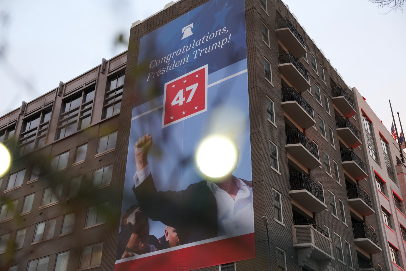 A Trump banner hangs on the side of The Heritage Foundation ahead of the Inauguration on January 17, 2025 in Washington, D.C. (Photo by Kayla Bartkowski/Getty Images)