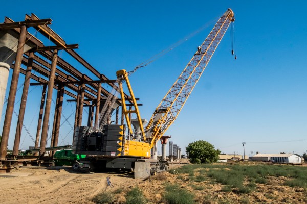 Series of cranes sitting near the high speed rail section near Nort and 99. Fresno, CA.