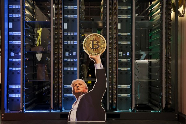 A cutout of President Donald Trump holding a bitcoin is displayed on a group of servers during the Bitcoin Conference at the Venetian Las Vegas on May 27, 2025. (Photo by Ian Maule/AFP/Getty Images)