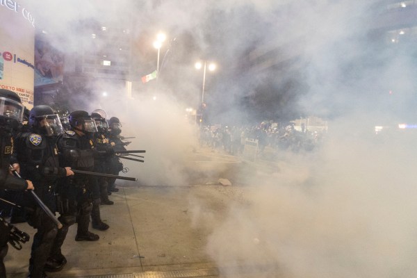 Police officers in riot clash with demonstrators during a protest following federal immigration operations in Los Angeles on June 9, 2025. (Photo by RINGO CHIU/AFP via Getty Images)