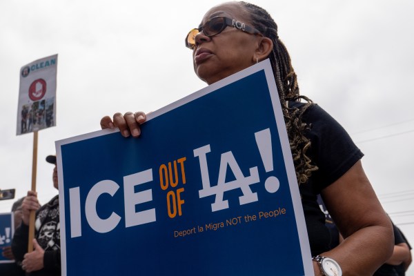 People attend a rally at a closed car wash where workers were detained in U.S. Immigration and Customs Enforcement (ICE) raids in West Los Angeles over the weekend on June 11, 2025, in Los Angeles, California. (Photo by Spencer Platt/Getty Images)