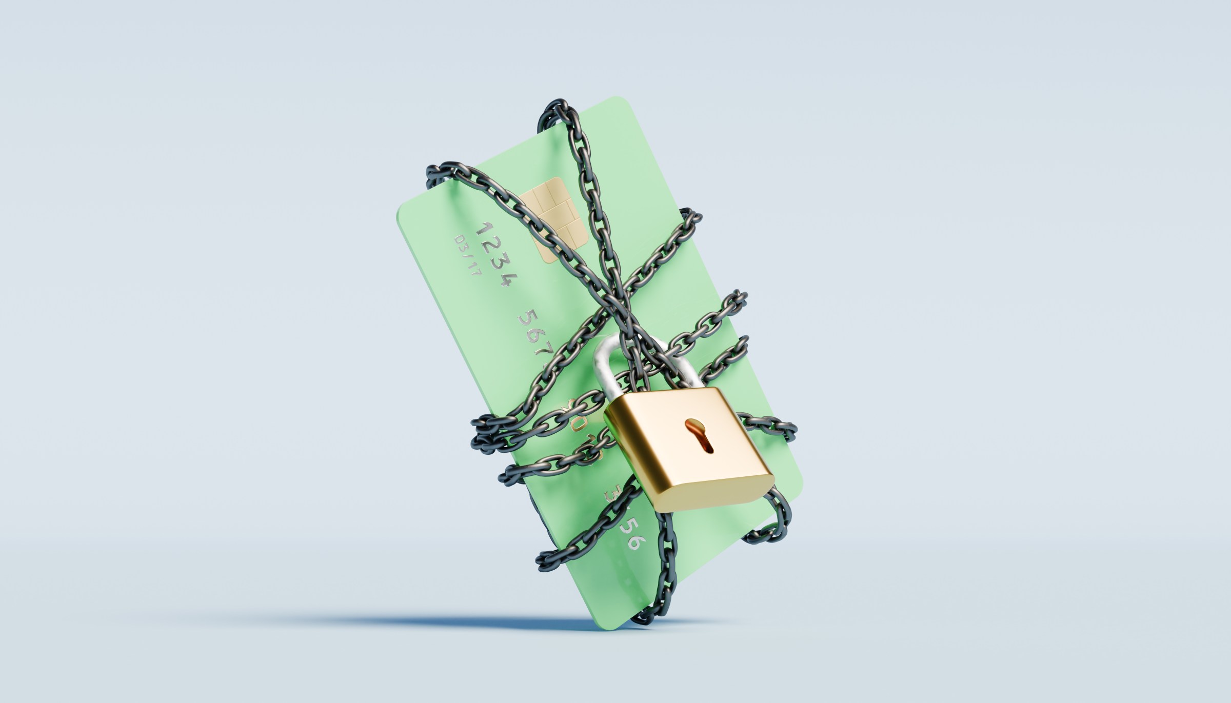 Green credit card wrapped in a chain with a lock