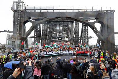 Protesters march across the Sydney Harbour Bridge during the