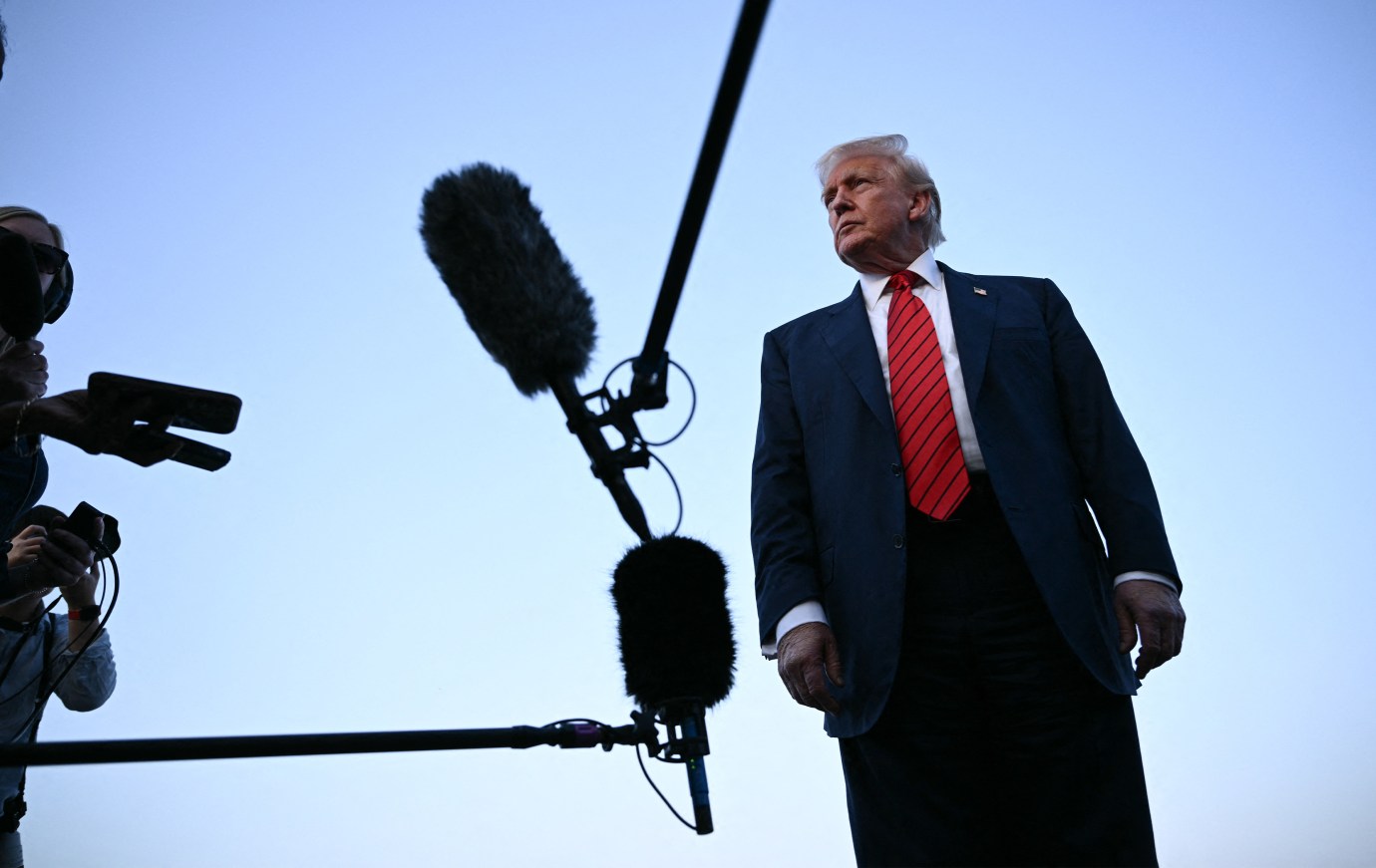President Donald Trump speaks to journalists at Lehigh Valley International Airport in Allentown, Pennsylvania. (Photo by Brendan  Smialowski/AFP via Getty Images)
