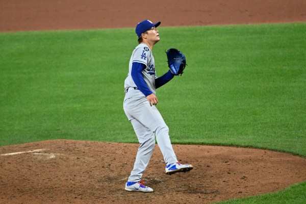 Yosihinobu Yamamoto of the Los Angeles Dodgers watches the flight of a home run ball hit by Jackson Holliday of the Baltimore Orioles during the ninth inning of an interleague game at Oriole Park on September 6, 2025, in Baltimore. The Orioles beat the Dodgers, 4-3. (Photo by Diamond Images via Getty Images)