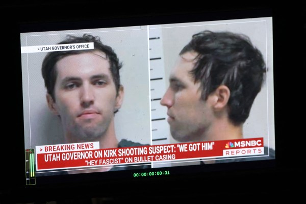 A TV monitor displays a picture of Tyler Robinson, suspected of killing Charlie Kirk on September 11, in Orem, Utah, on September 12, 2025. (Photo by PATRICK T. FALLON/AFP via Getty Images)