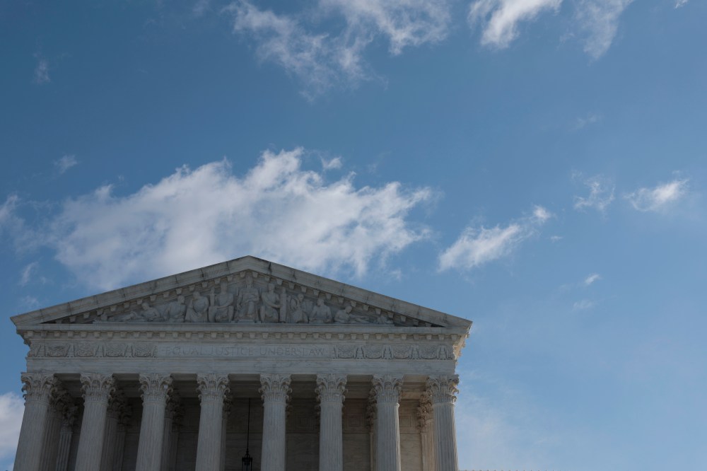 A building with columns and blue sky