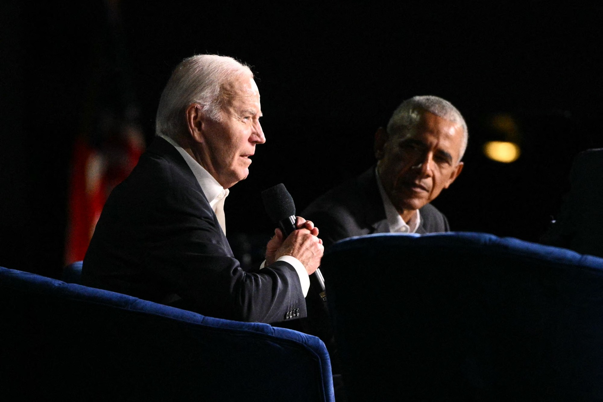 Two men sitting in chairs