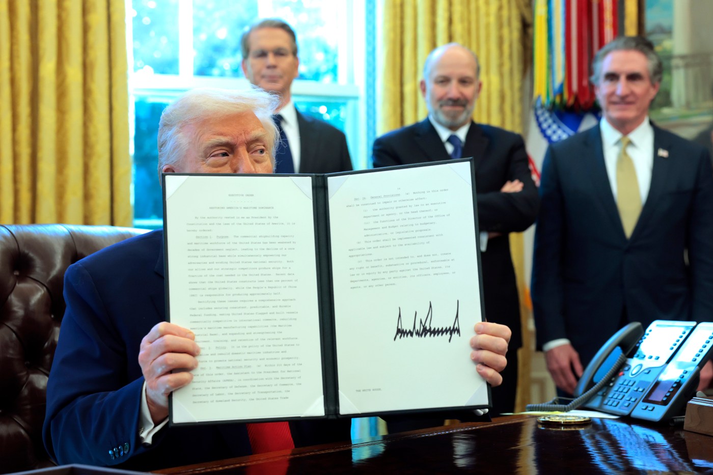 A man holding up a piece of paper