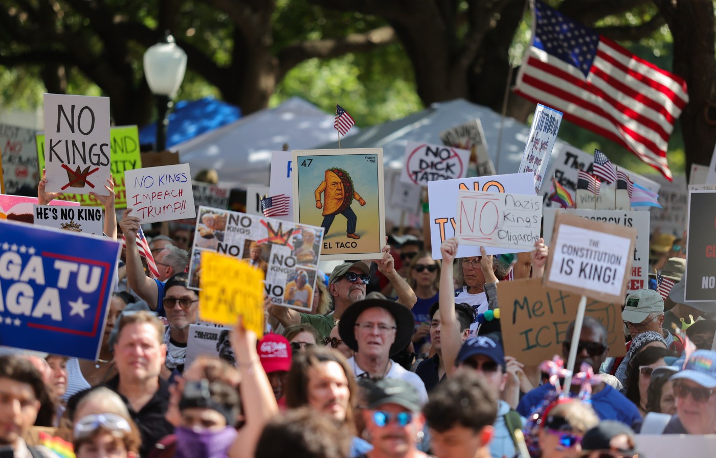 A group of people holding signs