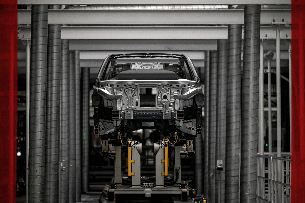 An unfinished electric vehicle sits on a production line at Chinese automaker NIO in Hefei, China, on September 24, 2025. (Photo by JADE GAO/AFP via Getty Images)
