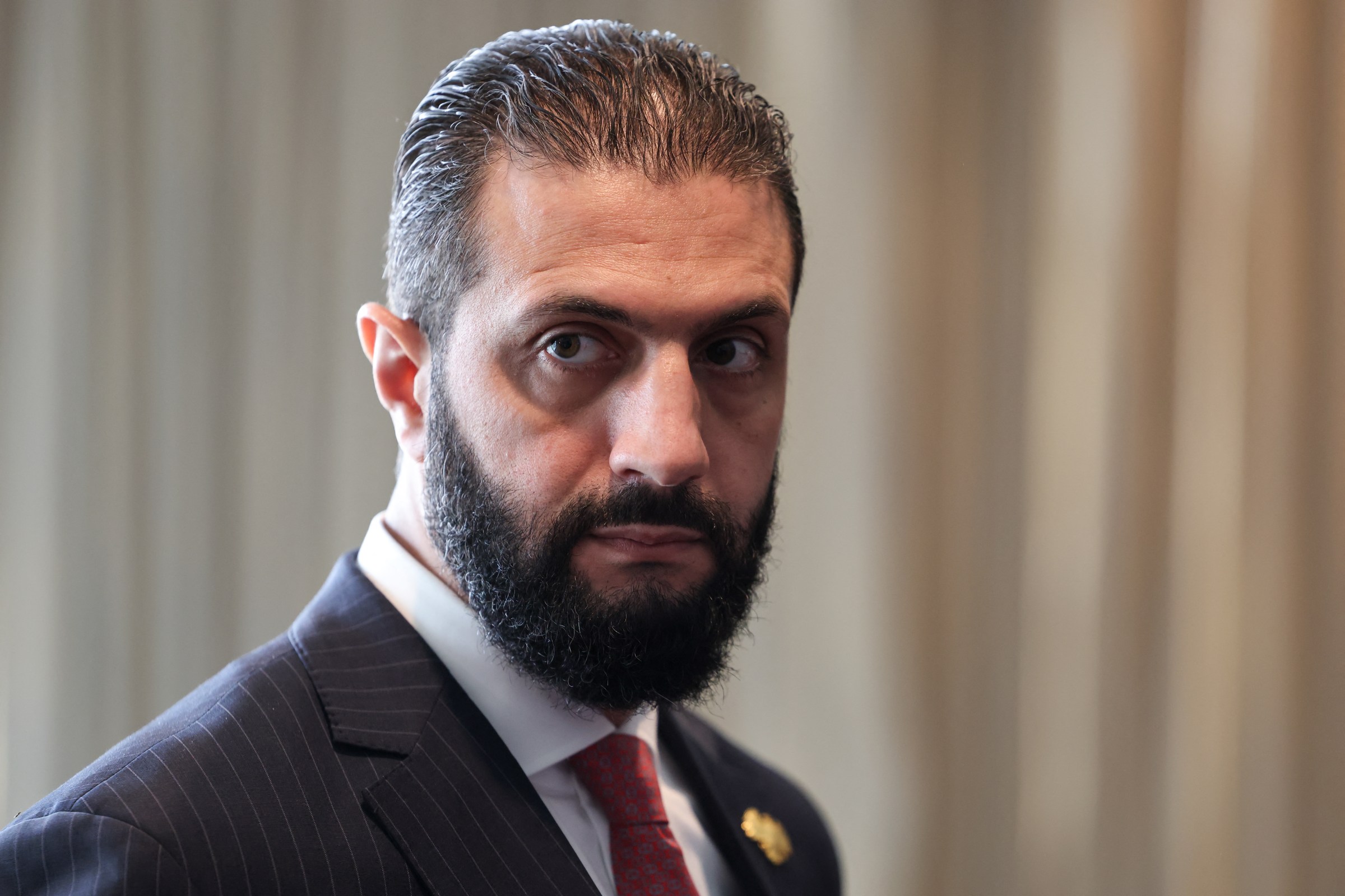 Syrian President Ahmed al-Sharaa waits to meet with France’s President Emmanuel Macron on the sidelines of the United Nations General Assembly at the UN headquarters in New York City on September 24, 2025. (Photo by LUDOVIC MARIN/POOL/AFP via Getty Images)
