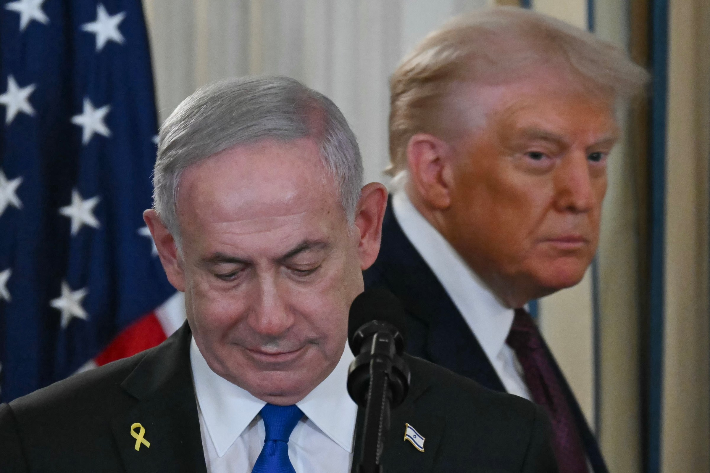 President Donald Trump and Israeli Prime Minister Benjamin Netanyahu arrive for a press conference in the State Dining Room of the White House in Washington, D.C., on September 29, 2025. (Photo by ANDREW CABALLERO-REYNOLDS/AFP via Getty Images)