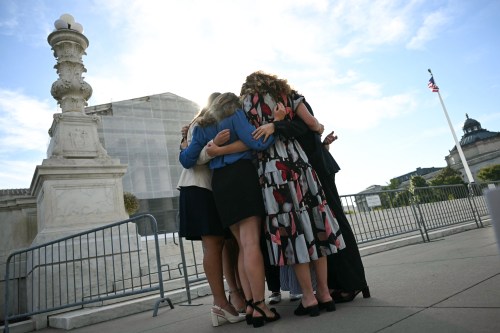 A group of women hugging
