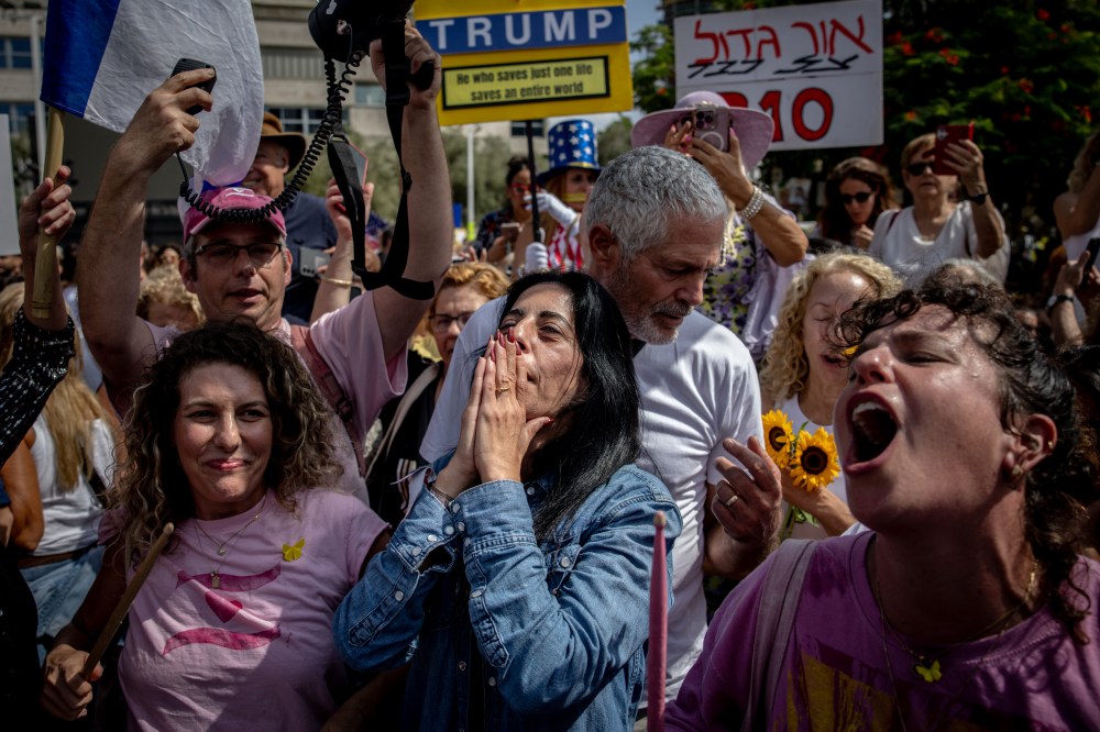 A woman covering her mouth with her hands