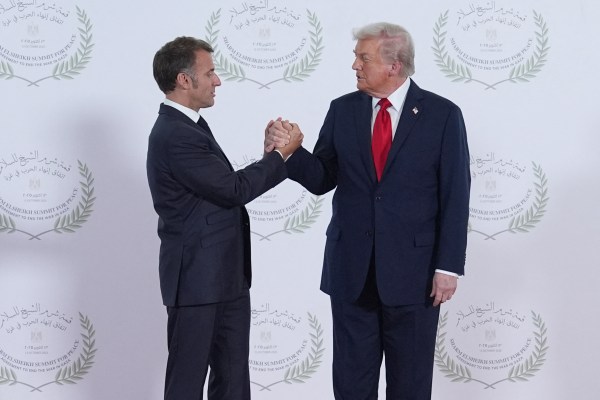 Two men in suits shaking hands