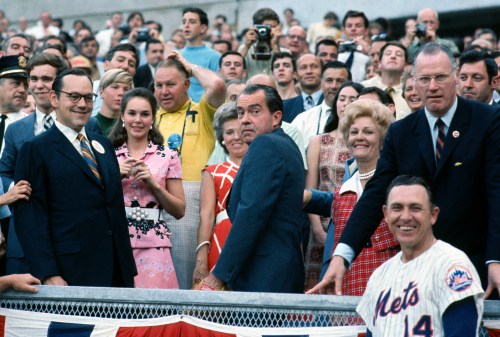 A group of people standing in front of a crowd