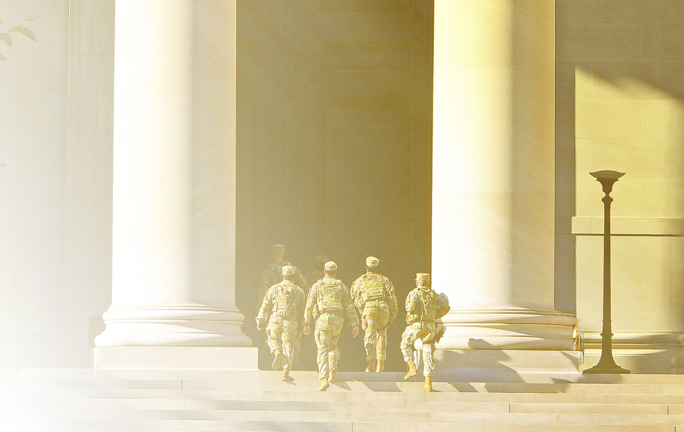 A group of soldiers walking up a staircase