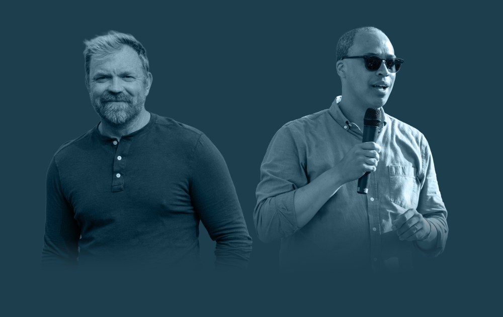 Two men holding microphones