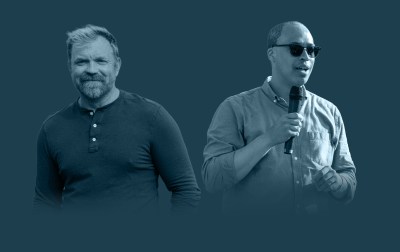 Two men holding microphones