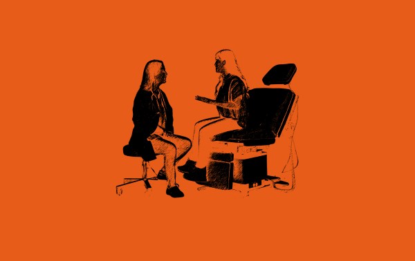 A woman sitting in a chair talking to a woman