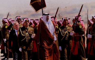 The Emir of Qatar Sheikh Tamim bin Hamad Al Thani (center) is welcomed by Jordan’s King Abdullah II (L) at Marka airport on September 17, 2025 in Amman, Jordan. (Photo by Salah Malkawi/Getty Images)