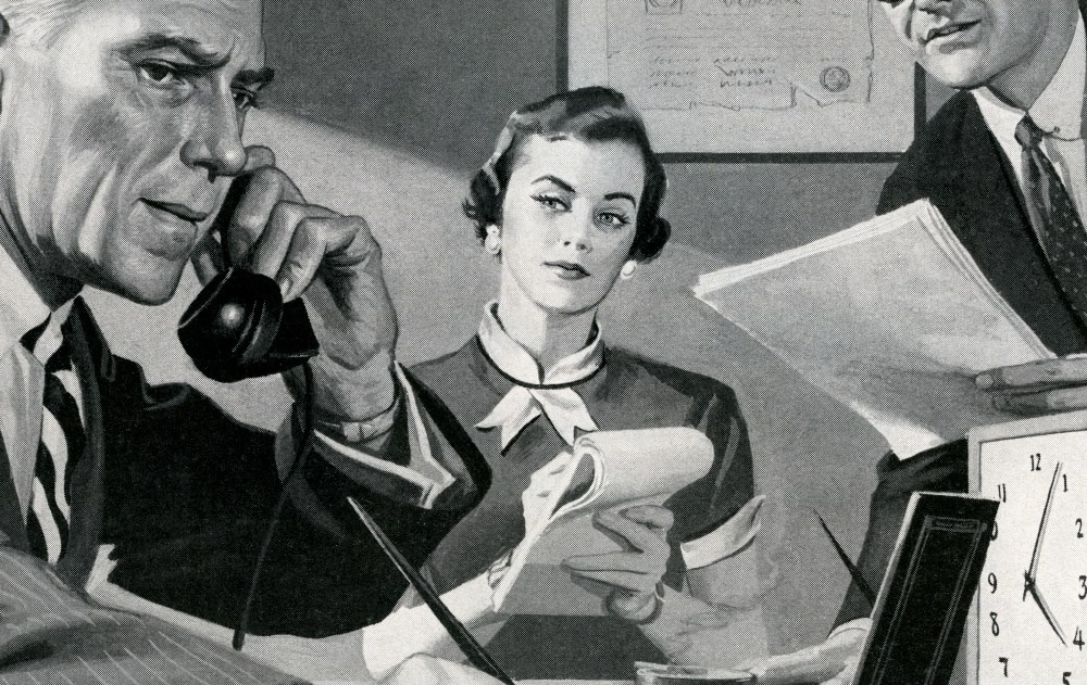 A woman holding a telephone