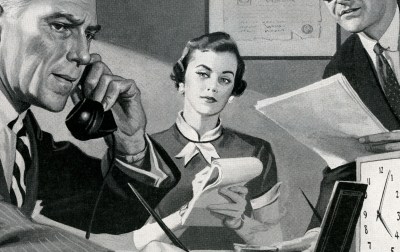 A woman holding a telephone