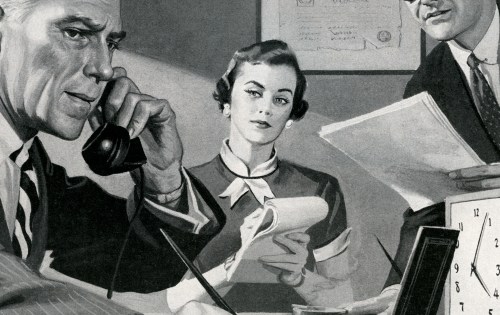 A woman holding a telephone