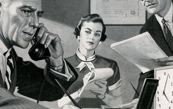 A woman holding a telephone