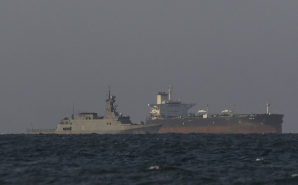A Venezuelan navy patrol boat escorts Panamanian flagged crude oil tanker Yoselin near the El Palito refinery in Puerto Cabello, Venezuela on November 11, 2025. (Photo by JUAN CARLOS HERNANDEZ/AFP via Getty Images)
