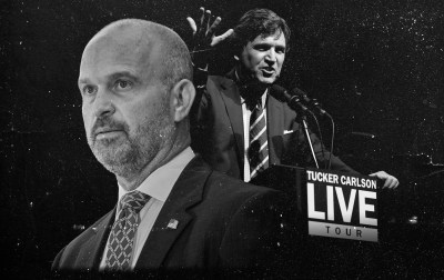 A man standing behind a microphone