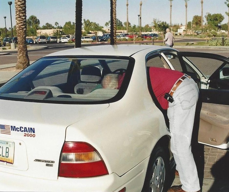 A person getting into a car