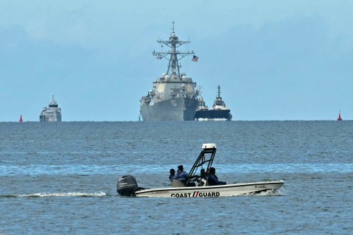 The USS Gravely warship is seen at a distance from Port of Spain on October 26, 2025. (Photo by Martin BERNETTI/AFP/Getty Images)